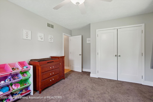 2605 College Rd, Holt, MI 48842 - carpeted bedroom with a closet and ceiling fan