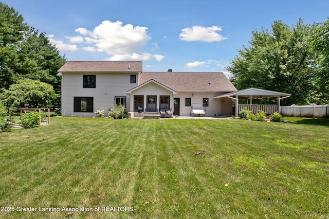 2605 College Rd, Holt, MI 48842 - back of house with a patio area