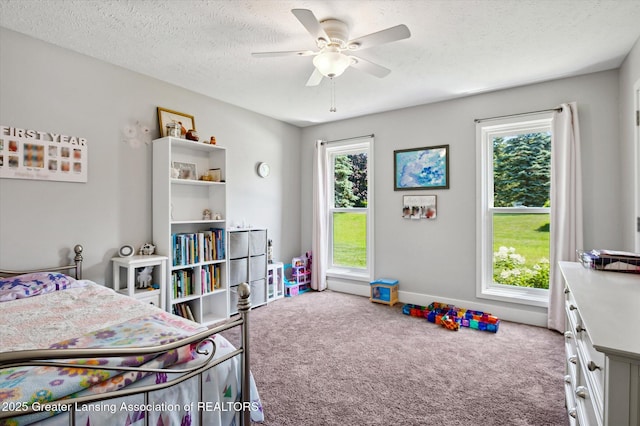 2605 College Rd, Holt, MI 48842 - bedroom featuring carpet flooring, ceiling fan, and a textured ceiling