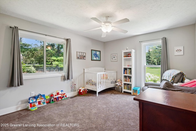 2605 College Rd, Holt, MI 48842 - bedroom with carpet flooring, ceiling fan, and a textured ceiling
