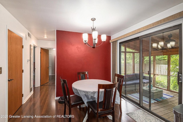 1614 N Eifert Rd, Holt, MI 48842 - dining area featuring a chandelier and dark wood-style flooring
