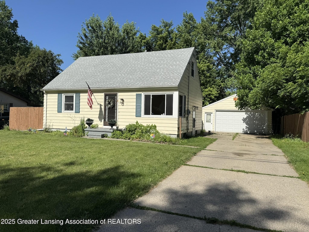 6910 Cooper Rd, Lansing, MI 48911 - new england style home with an outbuilding, a garage, and roof with shingles