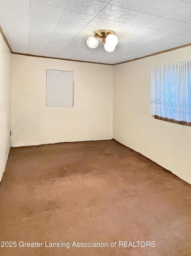 103 Norway Rd, Roscommon, MI 48653 - carpeted empty room featuring crown molding