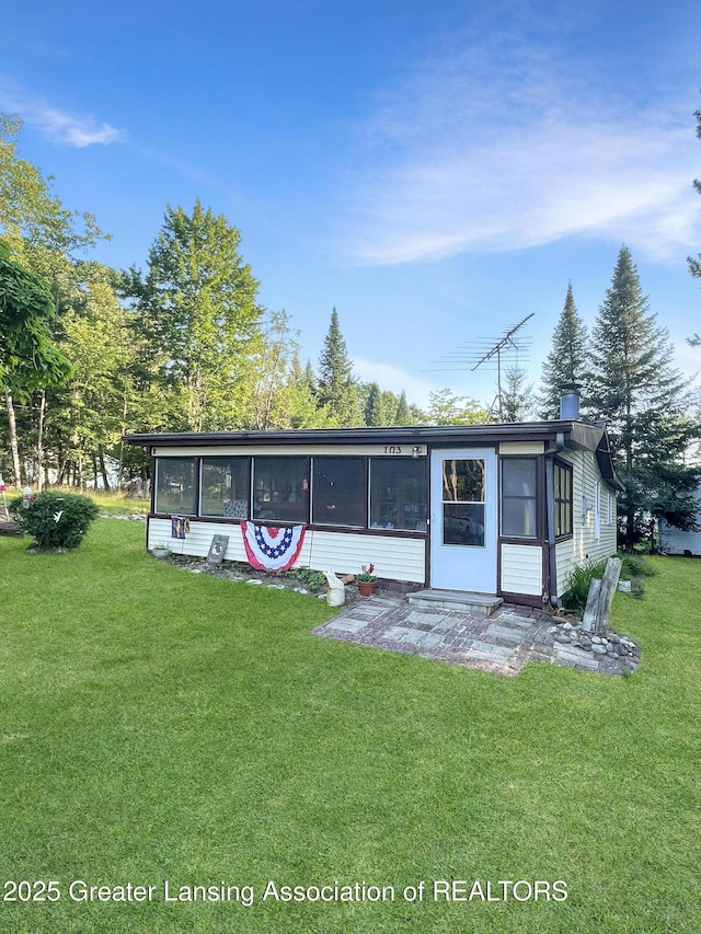 103 Norway Rd, Roscommon, MI 48653 - back of property with a yard and a sunroom