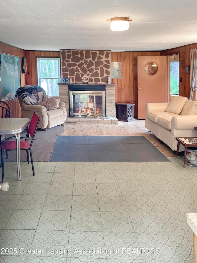 103 Norway Rd, Roscommon, MI 48653 - living area featuring wooden walls and a large fireplace