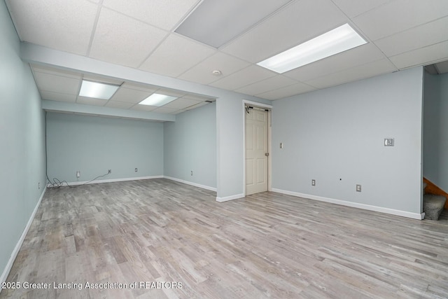 774 Tims View St, Potterville, MI 48876 - empty room featuring a drop ceiling, wood finished floors, and stairway