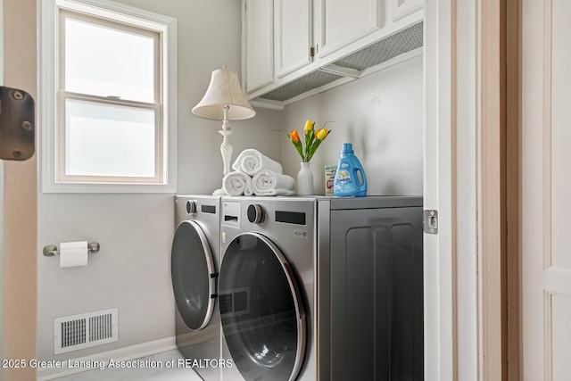 774 Tims View St, Potterville, MI 48876 - laundry room featuring cabinet space and separate washer and dryer