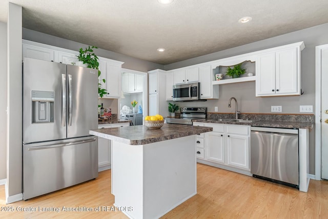 774 Tims View St, Potterville, MI 48876 - kitchen featuring stainless steel appliances, dark countertops, white cabinets, and recessed lighting