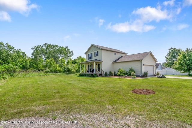 774 Tims View St, Potterville, MI 48876 - view of front of property featuring covered porch, a garage, and driveway