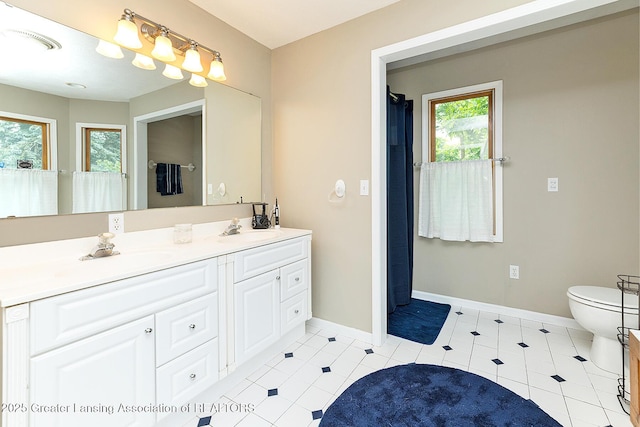 13689 Oneida Rd, Grand Ledge, MI 48837 - full bath with double vanity and tile patterned flooring