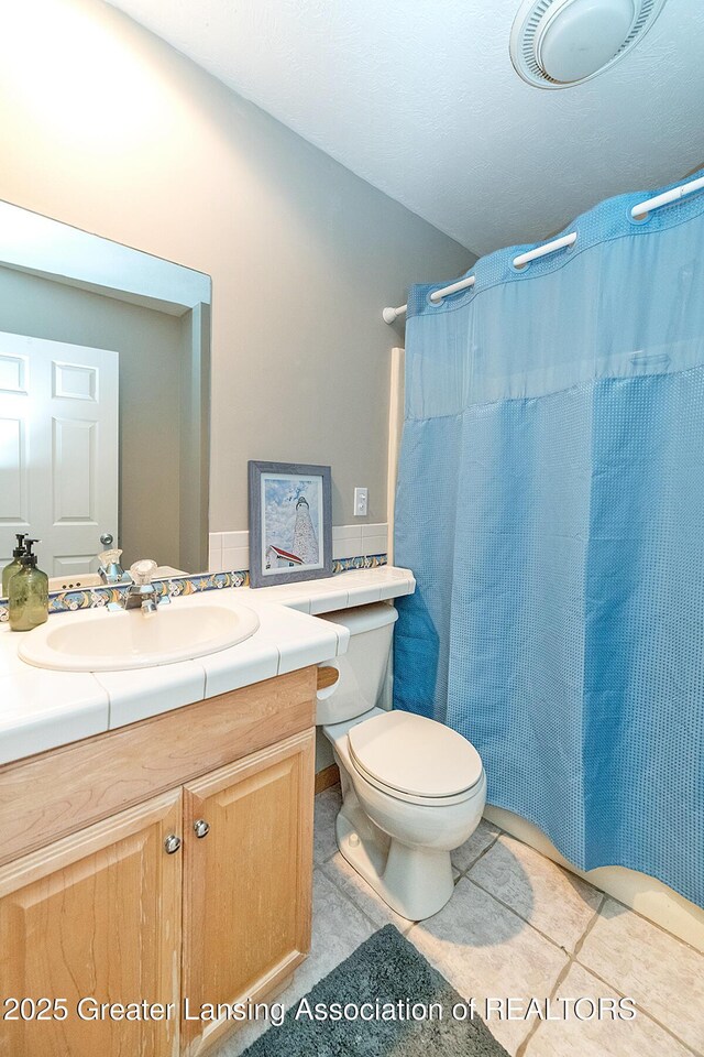 13689 Oneida Rd, Grand Ledge, MI 48837 - bathroom featuring vanity, a shower with shower curtain, and tile patterned flooring