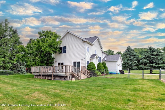 13689 Oneida Rd, Grand Ledge, MI 48837 - rear view of property featuring a deck and a fenced backyard
