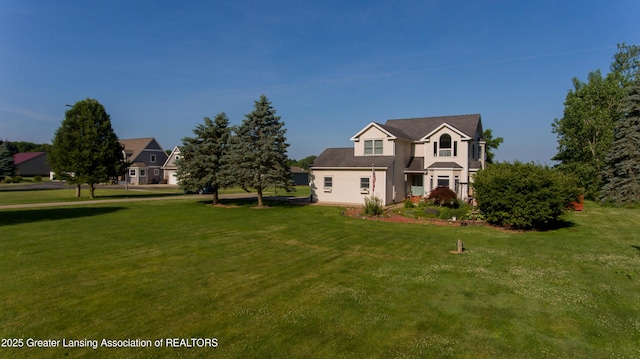 13689 Oneida Rd, Grand Ledge, MI 48837 - traditional-style house with a front yard