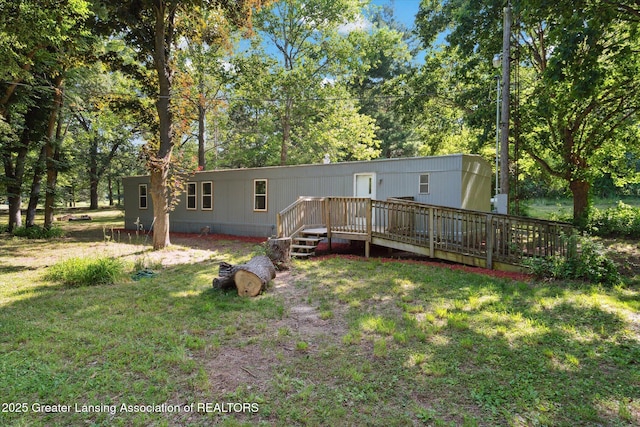27508 F Dr S, Albion, MI 49224 - back of property featuring a wooden deck and a lawn