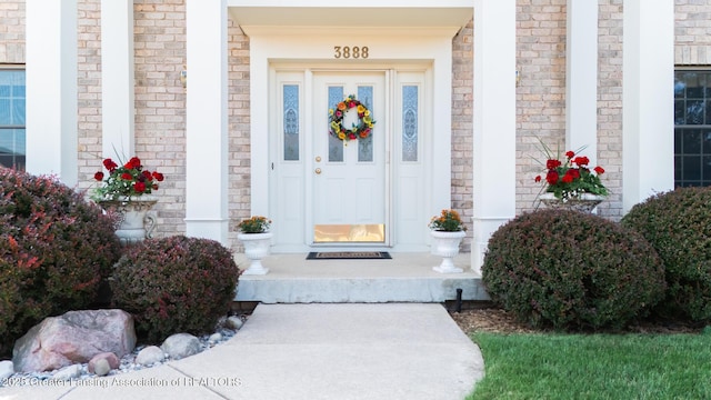 3888 Breckinridge Dr, Okemos, MI 48864 - view of exterior entry featuring a porch and brick siding