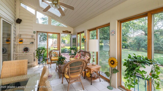 3888 Breckinridge Dr, Okemos, MI 48864 - sunroom with lofted ceiling, a ceiling fan, tile patterned flooring, and a skylight