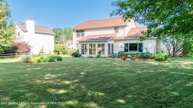 3888 Breckinridge Dr, Okemos, MI 48864 - back of house featuring a yard