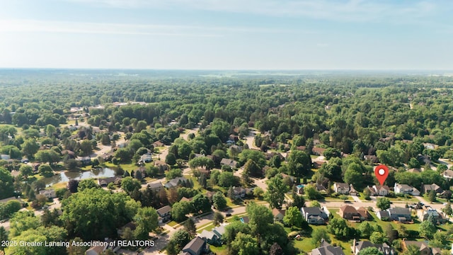 3888 Breckinridge Dr, Okemos, MI 48864 - aerial view of residential area with a heavily wooded area