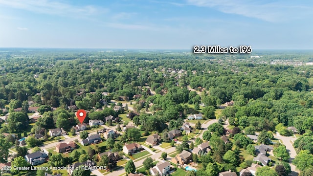 3888 Breckinridge Dr, Okemos, MI 48864 - aerial perspective of suburban area featuring a heavily wooded area