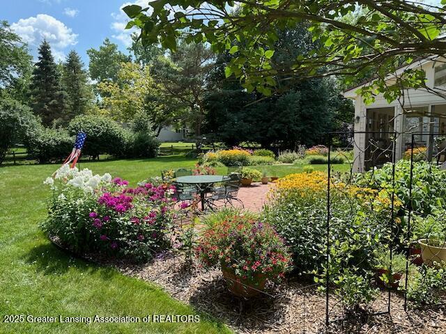 3888 Breckinridge Dr, Okemos, MI 48864 - view of grassy yard with a patio area