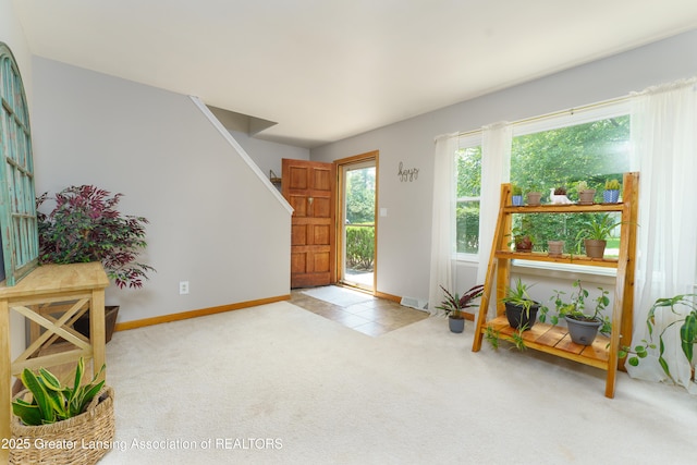 2162 Kent St, Okemos, MI 48864 - foyer featuring carpet floors and stairs