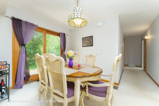 2162 Kent St, Okemos, MI 48864 - dining room with light colored carpet and baseboards