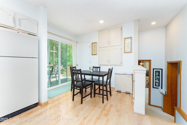 2162 Kent St, Okemos, MI 48864 - dining room with light wood-style floors, recessed lighting, and a textured ceiling