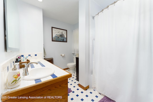 2162 Kent St, Okemos, MI 48864 - full bathroom with vanity, tile patterned floors, and a shower with curtain