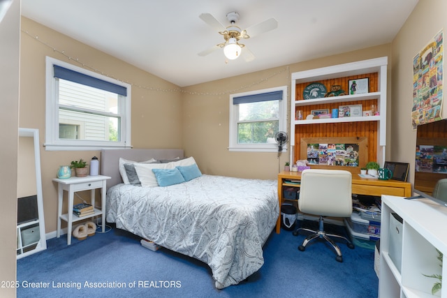 2162 Kent St, Okemos, MI 48864 - bedroom with carpet, a desk, and a ceiling fan