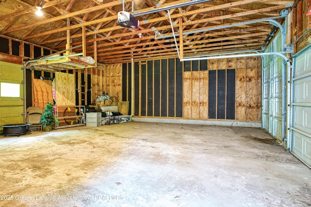 2162 Kent St, Okemos, MI 48864 - garage featuring a garage door opener