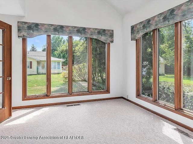 3619 W Arbutus Dr, Okemos, MI 48864 - carpeted empty room featuring vaulted ceiling and baseboards