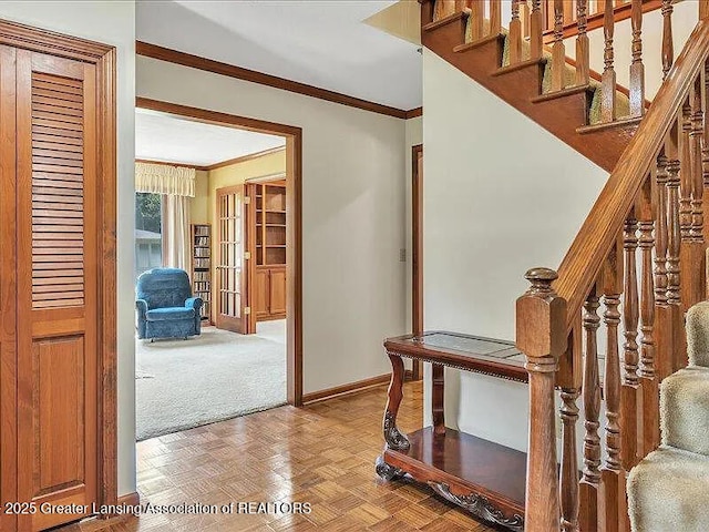 3619 W Arbutus Dr, Okemos, MI 48864 - stairway featuring crown molding and carpet floors