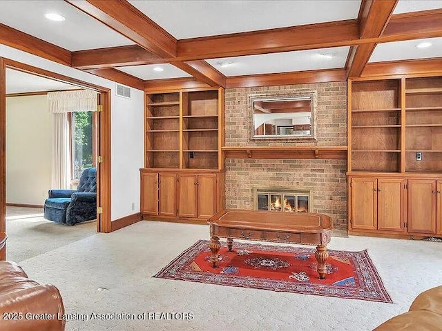 3619 W Arbutus Dr, Okemos, MI 48864 - living area featuring coffered ceiling, beamed ceiling, built in shelves, light carpet, and a brick fireplace