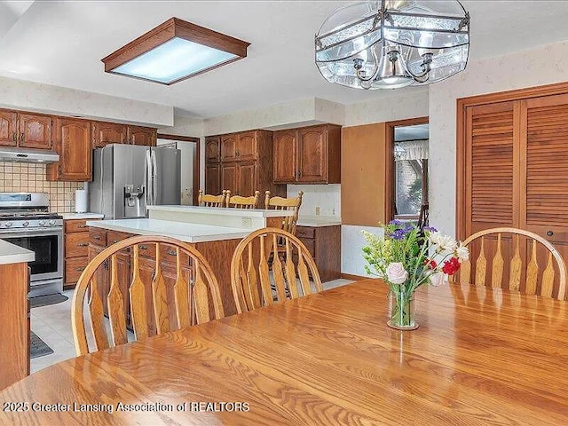 3619 W Arbutus Dr, Okemos, MI 48864 - dining area featuring a chandelier