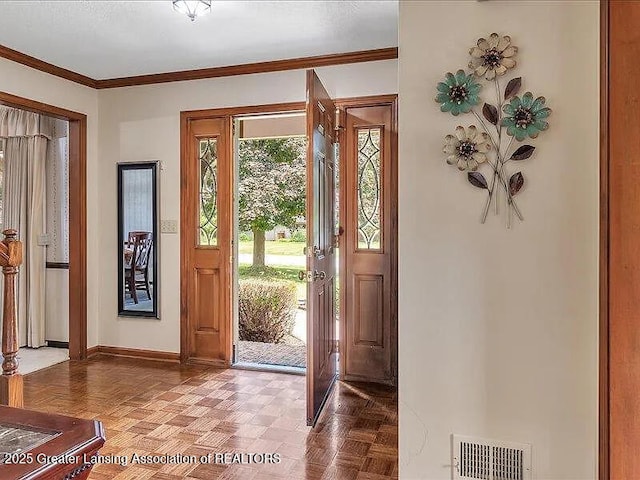 3619 W Arbutus Dr, Okemos, MI 48864 - entrance foyer featuring baseboards and crown molding