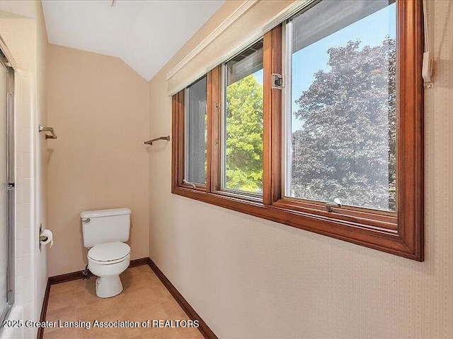 3619 W Arbutus Dr, Okemos, MI 48864 - bathroom with lofted ceiling and tile patterned floors