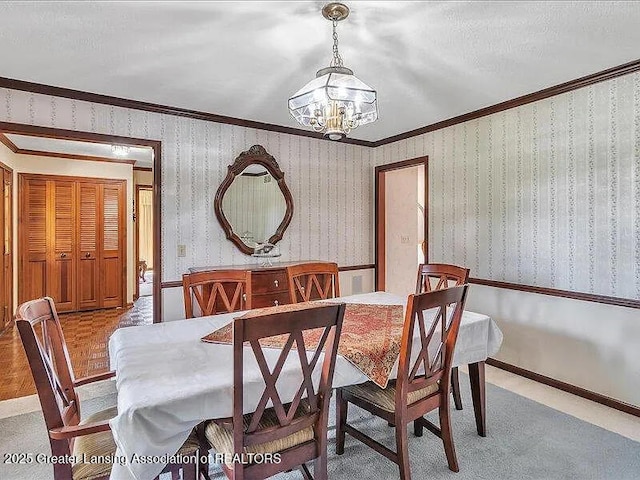 3619 W Arbutus Dr, Okemos, MI 48864 - dining room featuring a chandelier and crown molding