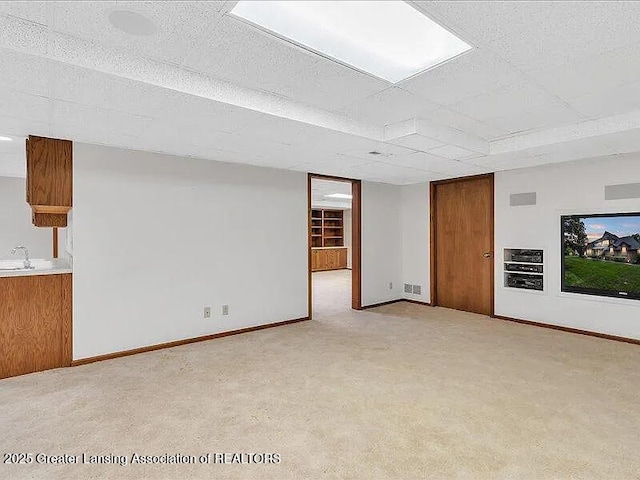 3619 W Arbutus Dr, Okemos, MI 48864 - unfurnished room with a sink and light colored carpet