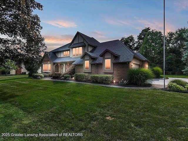 3619 W Arbutus Dr, Okemos, MI 48864 - view of front of house featuring a front yard and brick siding