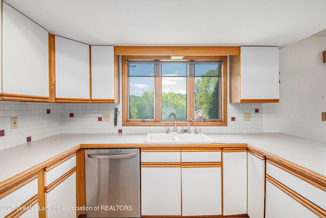 12829 Silver Ridge Dr, Grand Ledge, MI 48837 - kitchen with dishwasher, white cabinets, and decorative backsplash