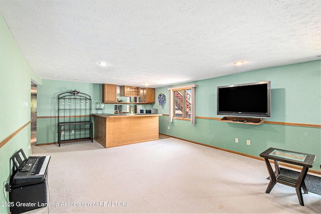 12829 Silver Ridge Dr, Grand Ledge, MI 48837 - unfurnished living room with carpet flooring and a textured ceiling