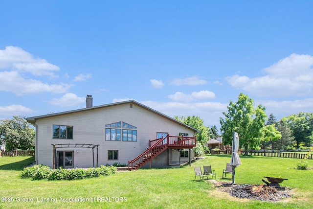 12829 Silver Ridge Dr, Grand Ledge, MI 48837 - rear view of property featuring stairs, a deck, a chimney, an outdoor fire pit, and a pergola
