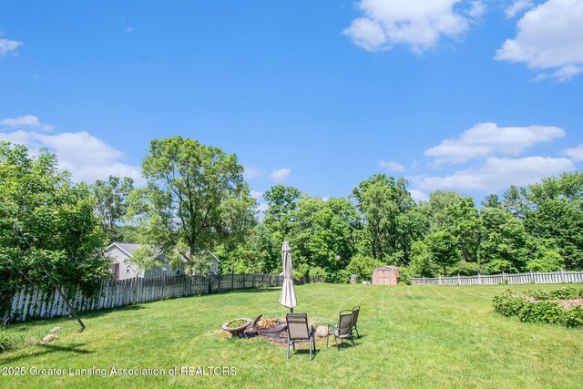 12829 Silver Ridge Dr, Grand Ledge, MI 48837 - fenced backyard featuring an outdoor fire pit and a shed