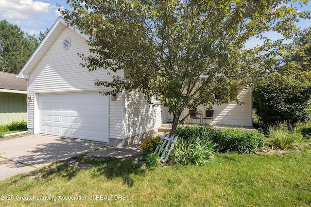 207 Queens Ct Unit 8, Grand Ledge, MI 48837 - view of home's exterior with concrete driveway and an attached garage