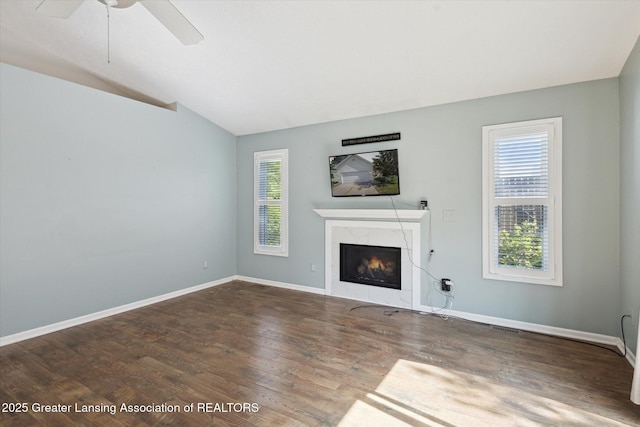 207 Queens Ct Unit 8, Grand Ledge, MI 48837 - unfurnished living room with lofted ceiling, a fireplace, wood finished floors, and a ceiling fan