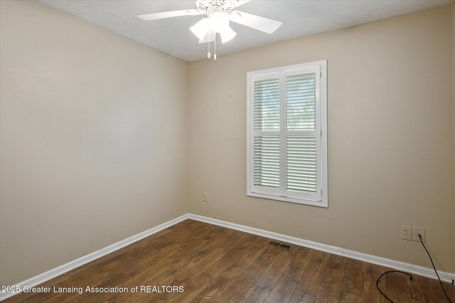 207 Queens Ct Unit 8, Grand Ledge, MI 48837 - spare room with dark wood-type flooring and a ceiling fan