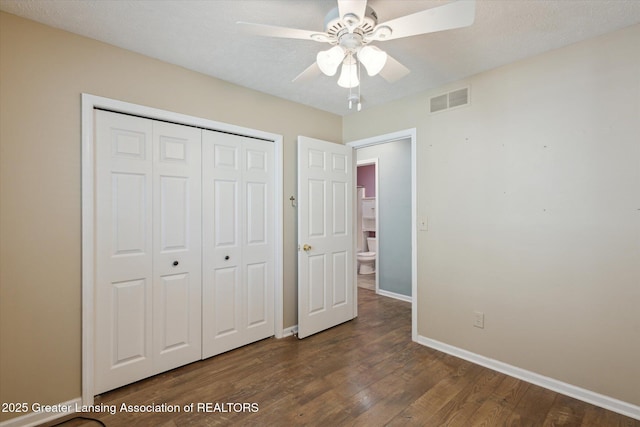 207 Queens Ct Unit 8, Grand Ledge, MI 48837 - unfurnished bedroom with wood finished floors, a closet, and a ceiling fan