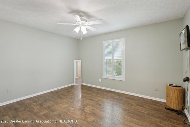207 Queens Ct Unit 8, Grand Ledge, MI 48837 - empty room featuring wood-type flooring, ceiling fan, and a textured ceiling