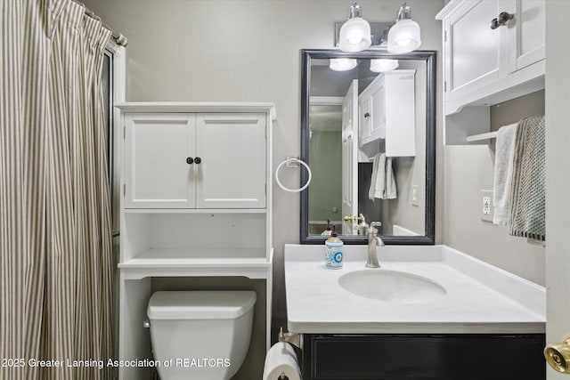 207 Queens Ct Unit 8, Grand Ledge, MI 48837 - bathroom featuring toilet and vanity