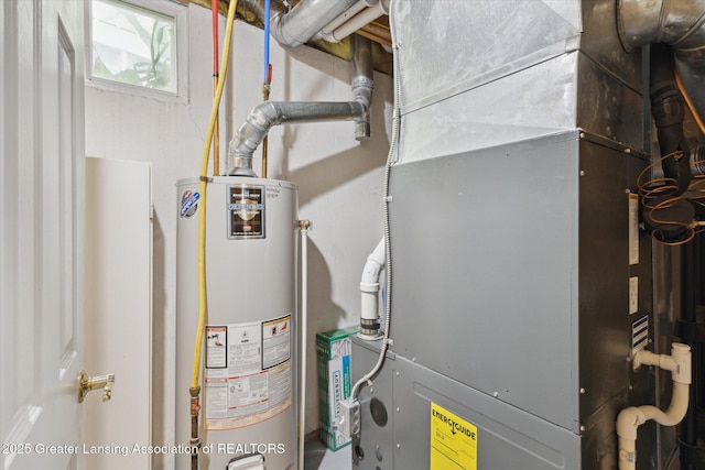 207 Queens Ct Unit 8, Grand Ledge, MI 48837 - utility room with gas water heater and heating unit